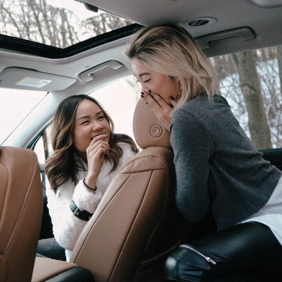 Sharing secrets in the warmth and luxury of the Buick Enclave.